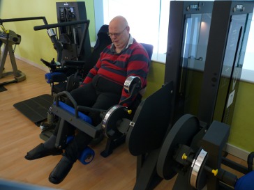 Trying to work the hamstring curl machine